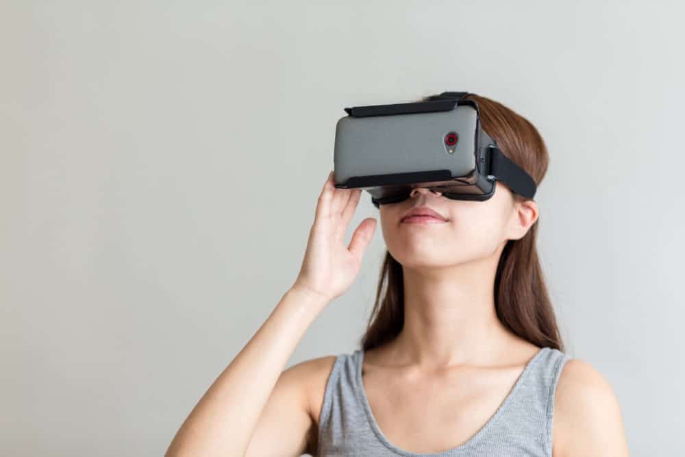 Girl looking through VR headset